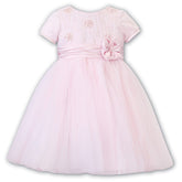 Sarah Louise Ceremonial Ballerina Dress in a delicate hand-pleated bodice with clusters of flowers adorned with pearls and a beautiful Satin flower at the waist.
